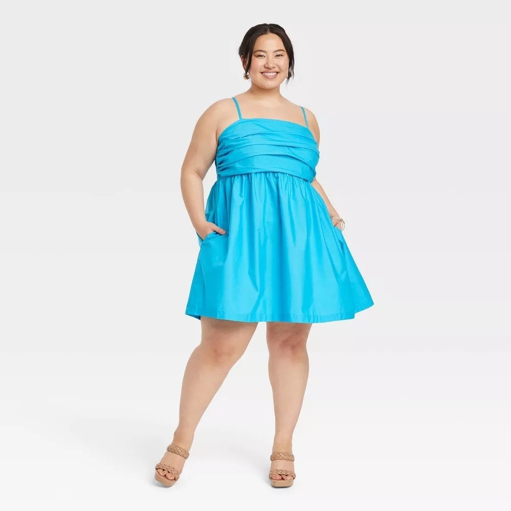 A model wearing the blue dress