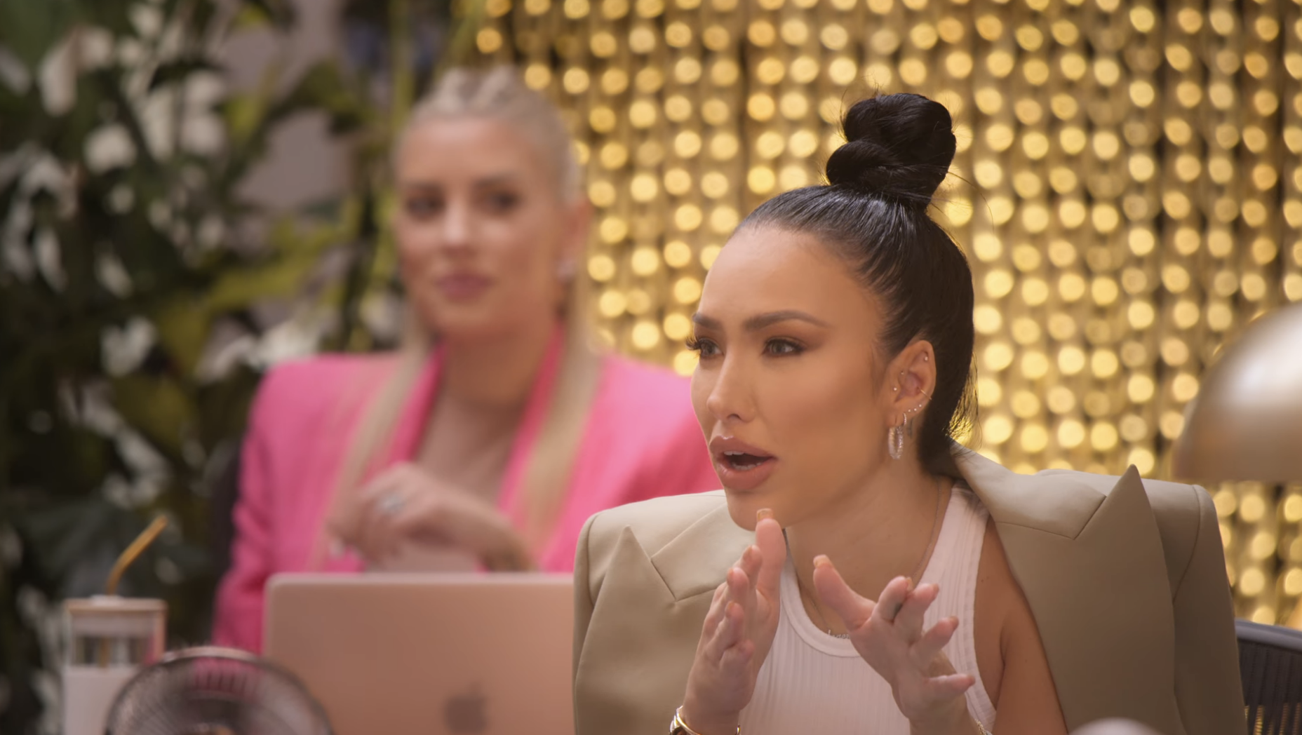 Bre talking to the group while Heather smirks behind her