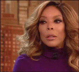 Wendy Williams shaking her had and sipping her tea
