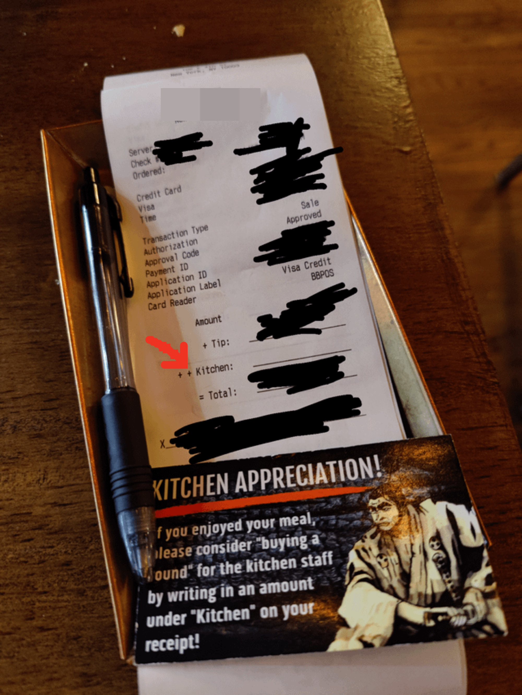 A receipt with a place to tip the kitchen staff