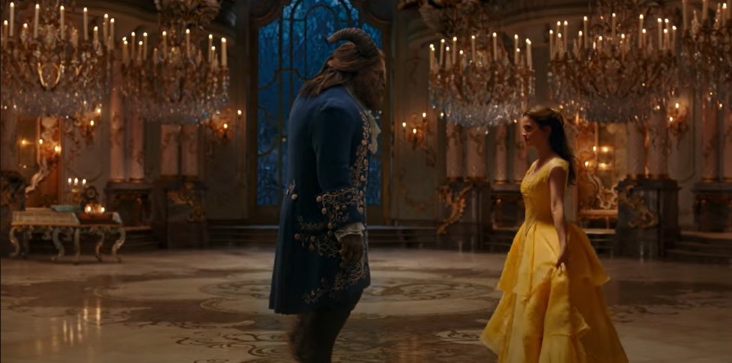 The Beast and Belle dance in a grand ballroom from &quot;Beauty and the Beast.&quot; Belle wears a flowing yellow gown