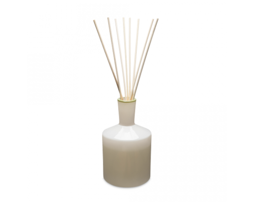 A large white LAFCO reed diffuser with reed sticks inside it