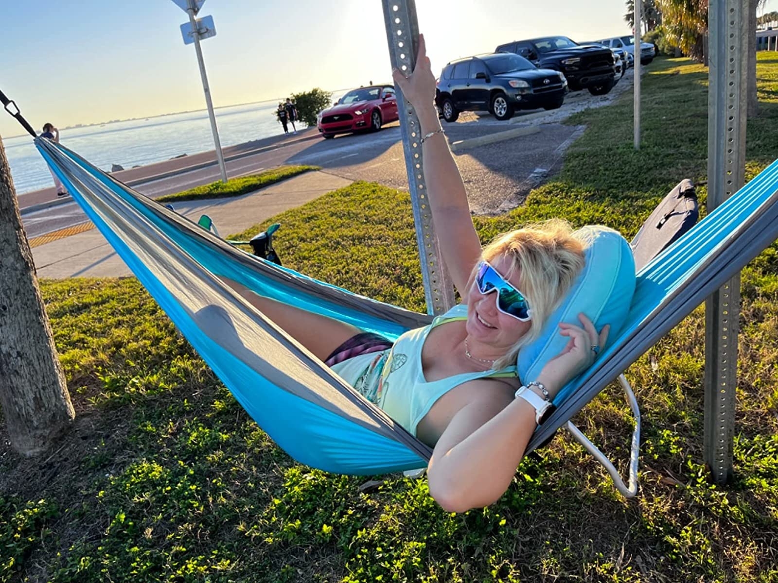 reviewer chilling in the hammock by beach