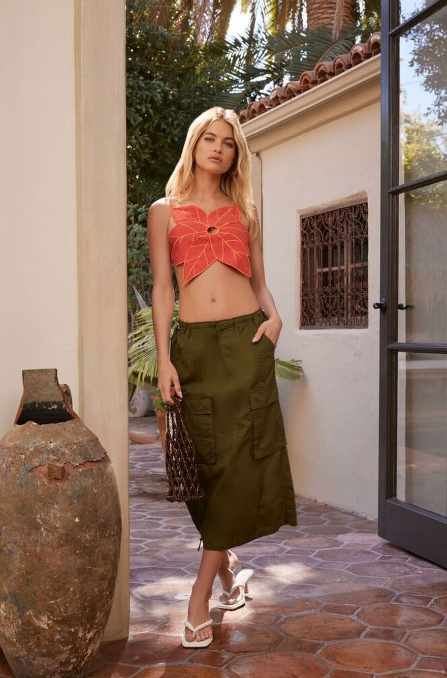model wearing green cargo skirt