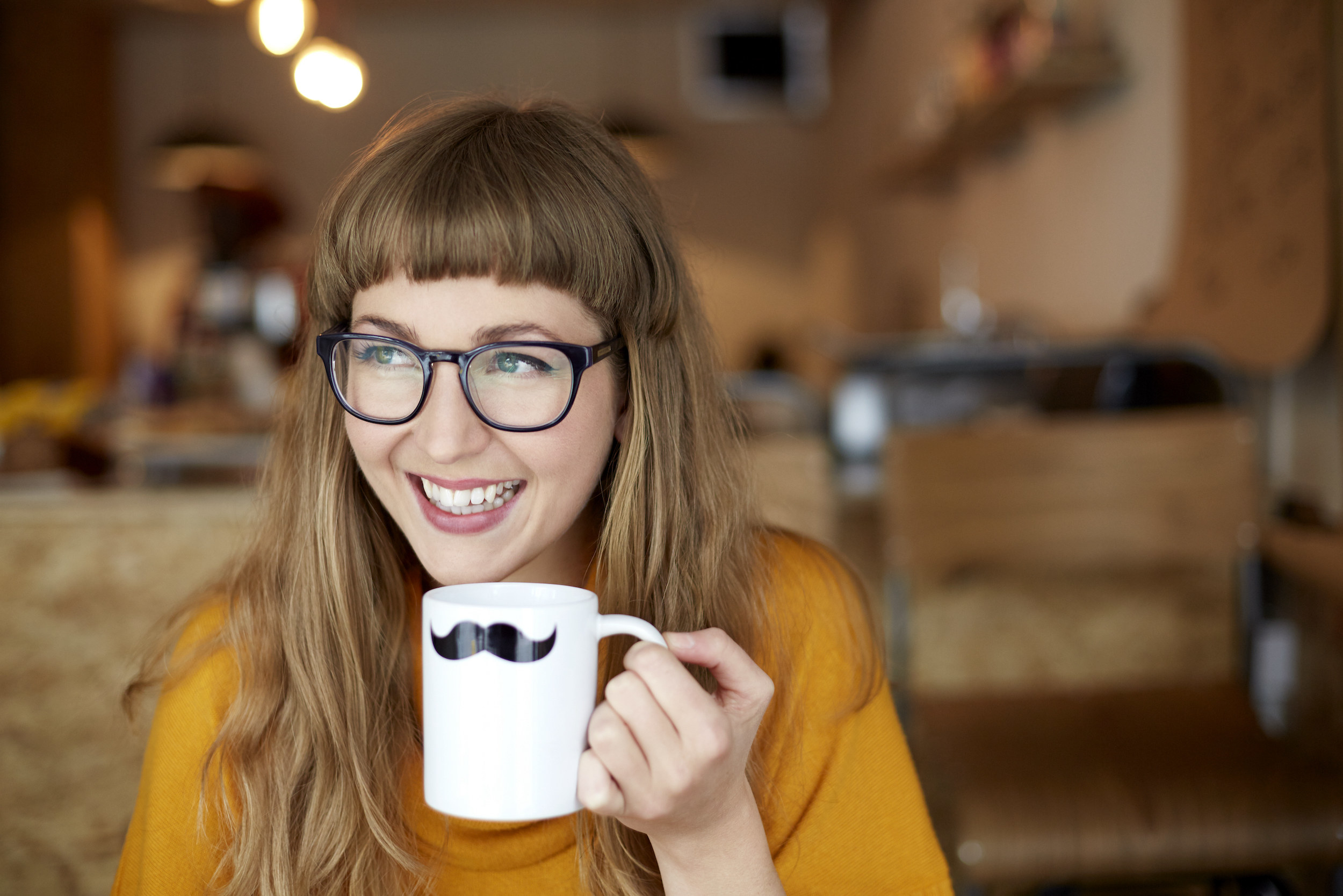 A woman sipping coffee