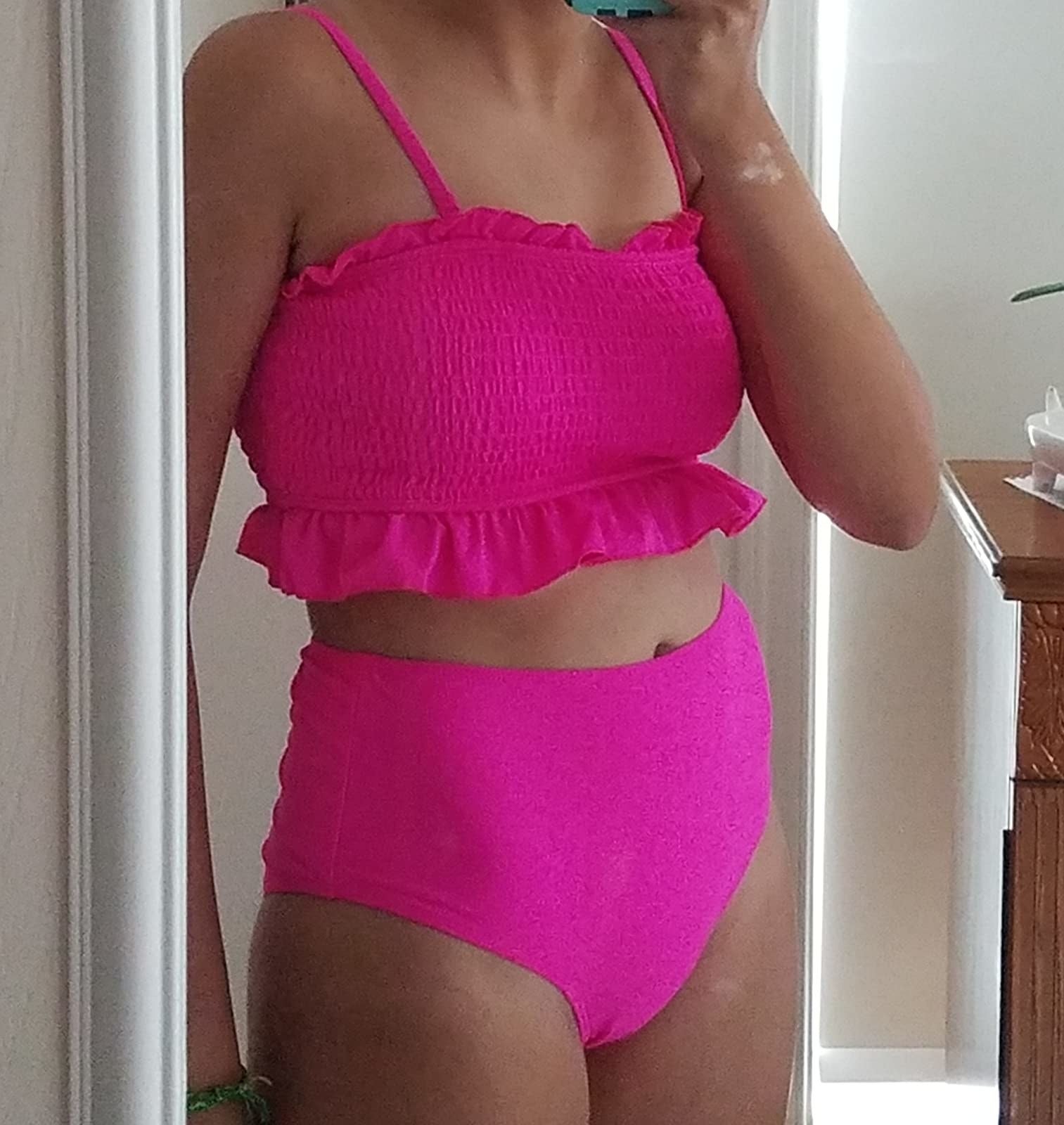 different reviewer wearing the suit   successful  pink