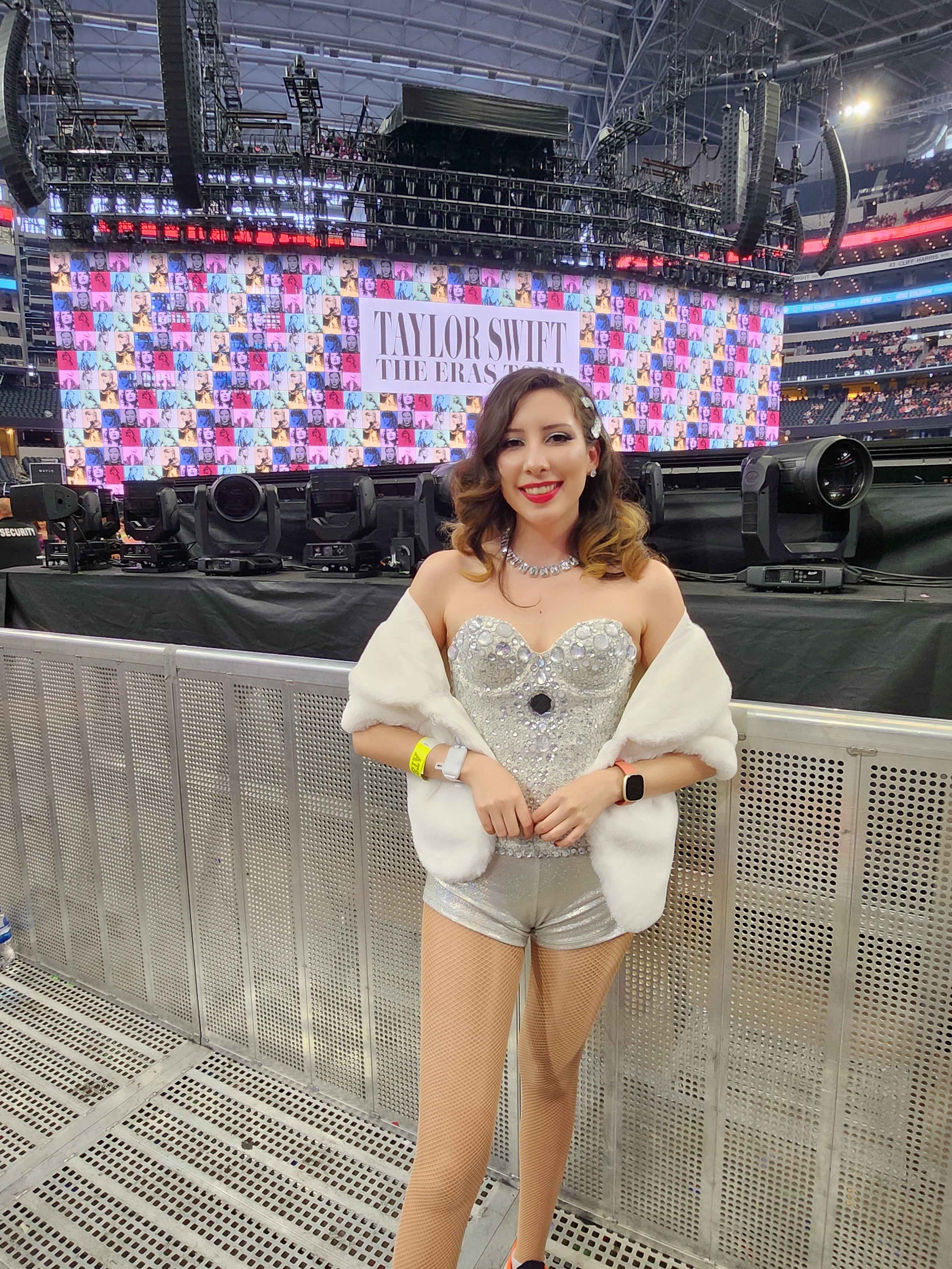 woman in a jeweled corset top and matching shorts with a faux fur