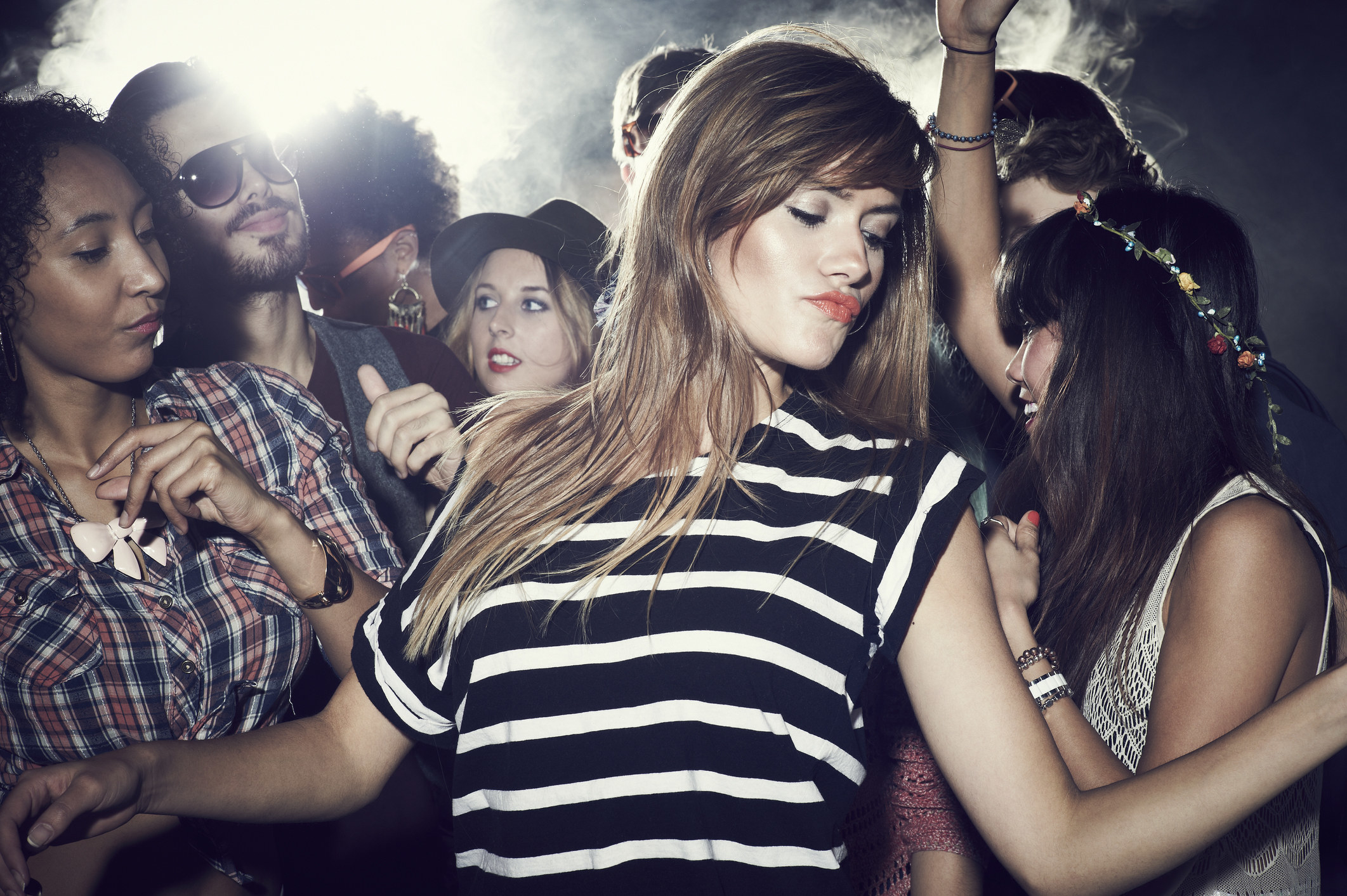 A young woman in a crowd at a concert