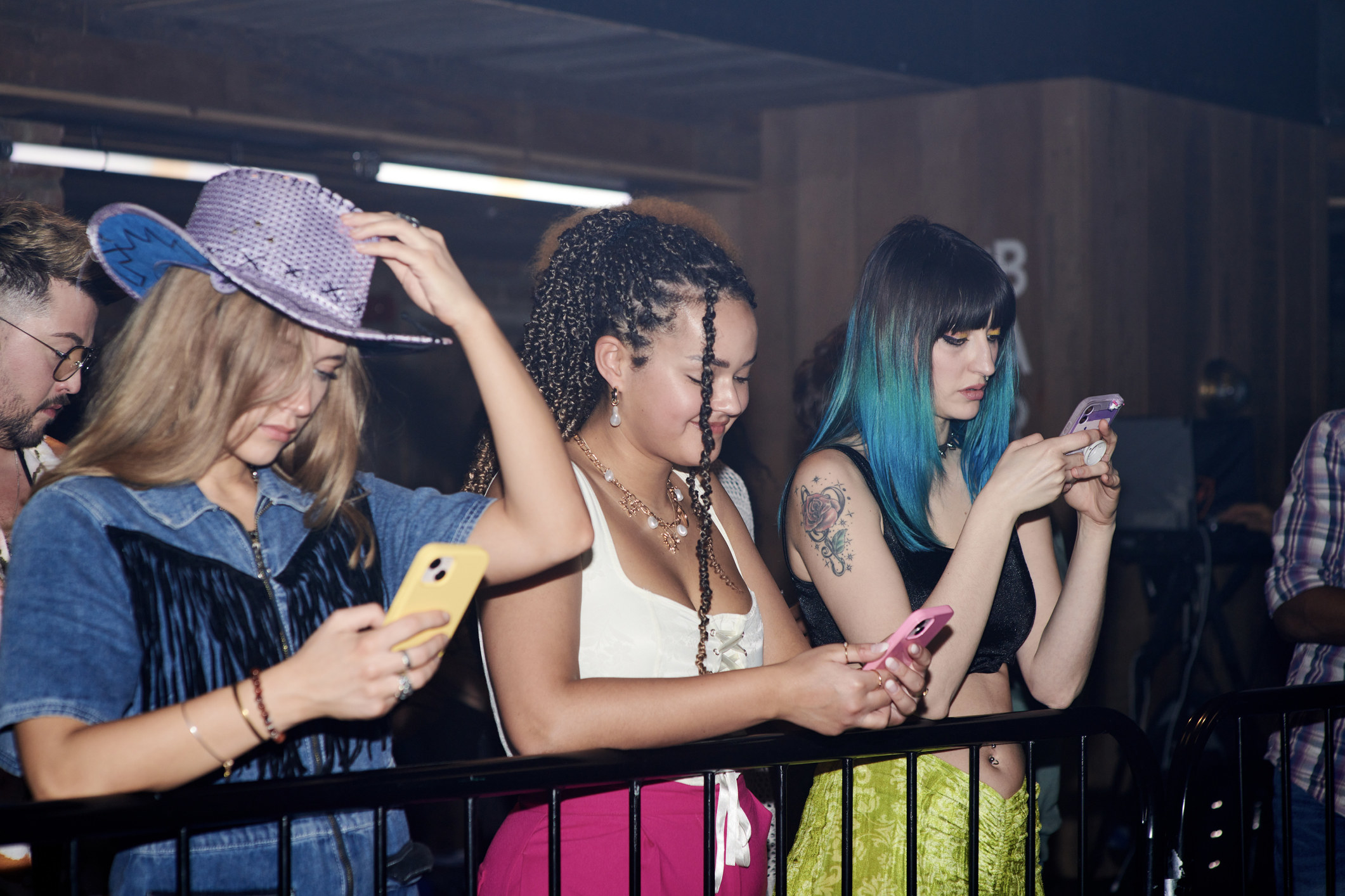 Concert-goers on their phones