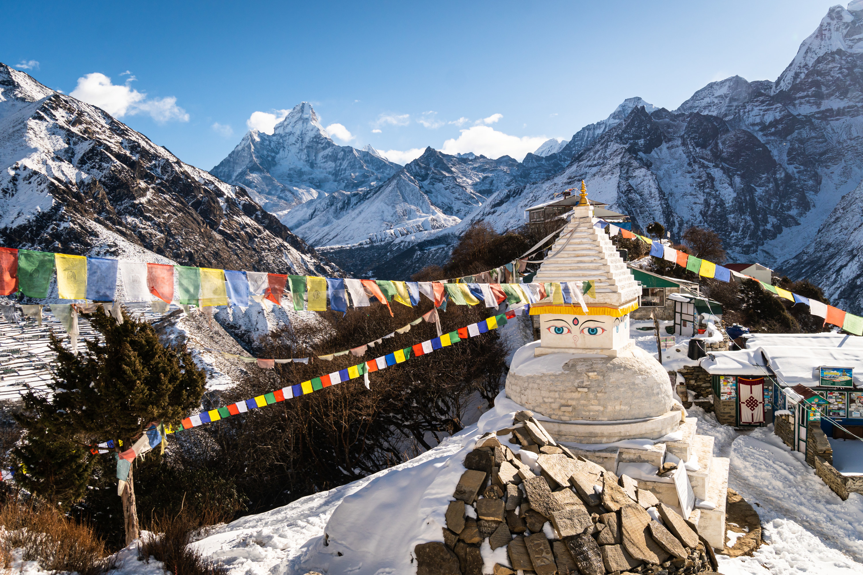 Religious monument surrounded by snow-covered peaks