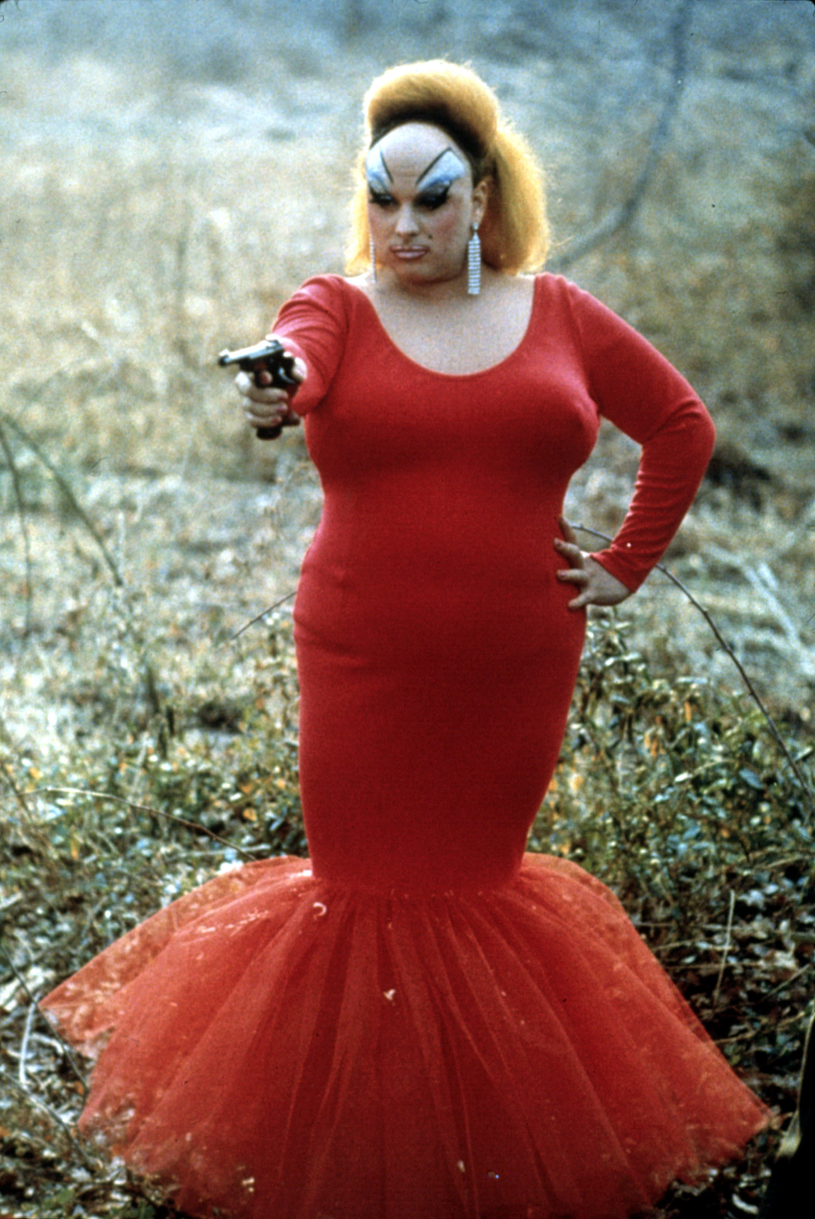 divine points a gun in a scene from the film pink flamingos