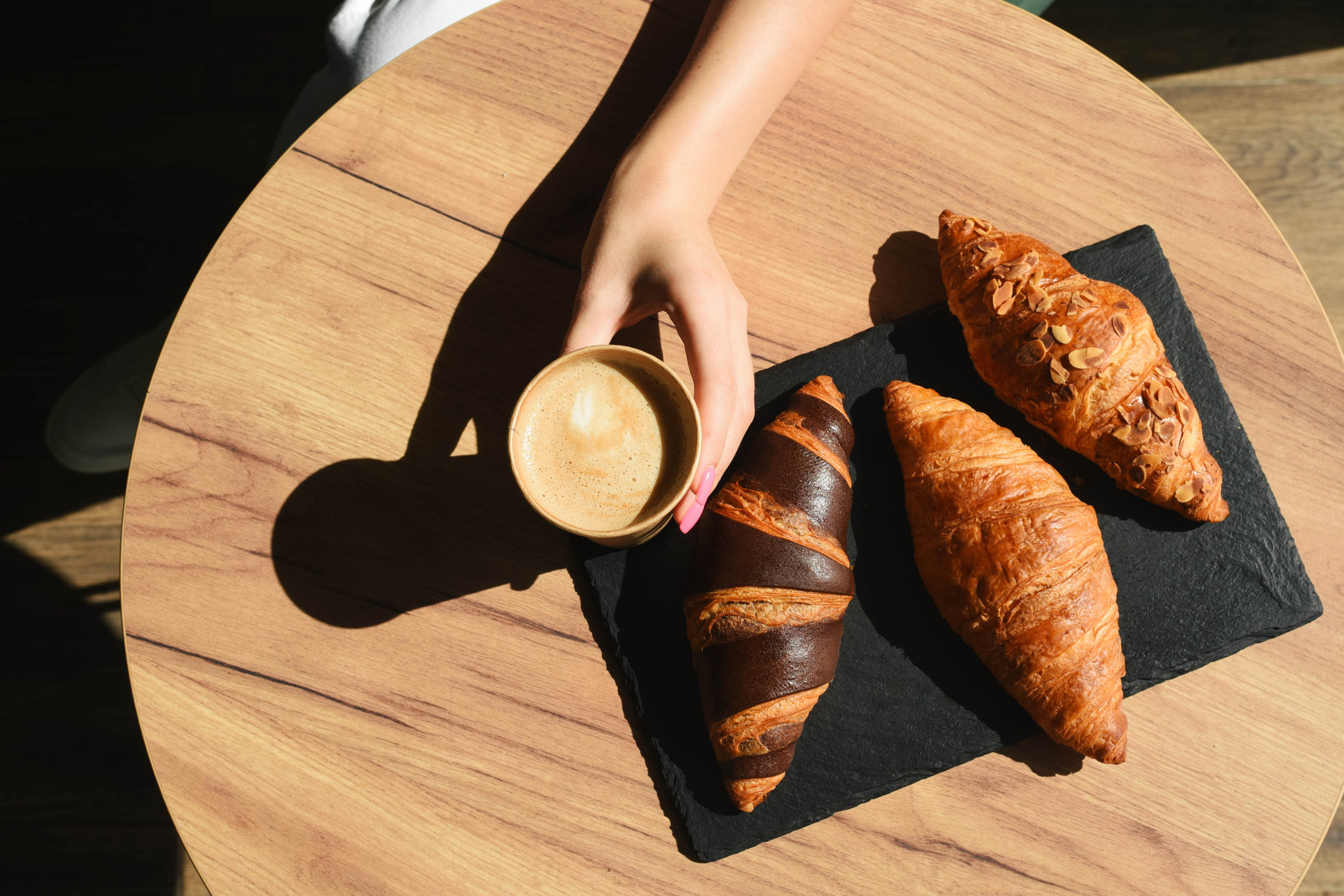 Coffee and croissants on a small table