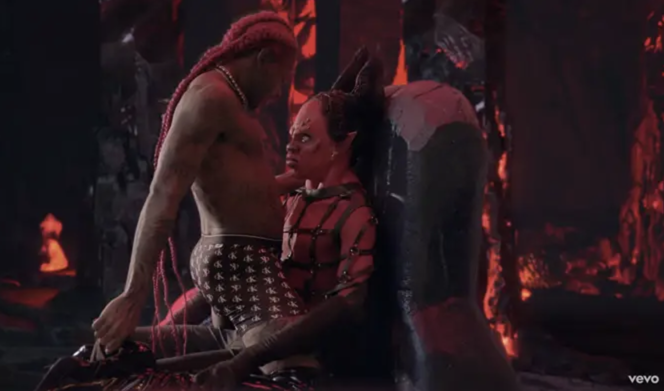 李尔Nas X的截图,赤膊上阵,给一个人装扮成膝上艳舞的撒旦,坐在宝座上