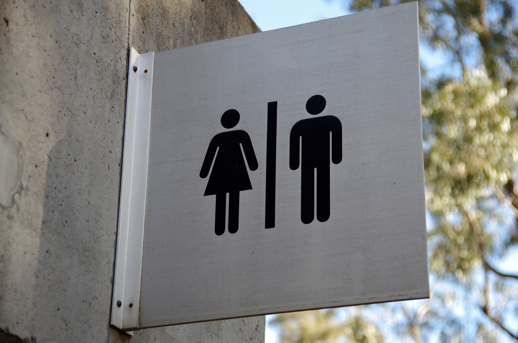 Female and male toilet sign on the exterior of a public restroom