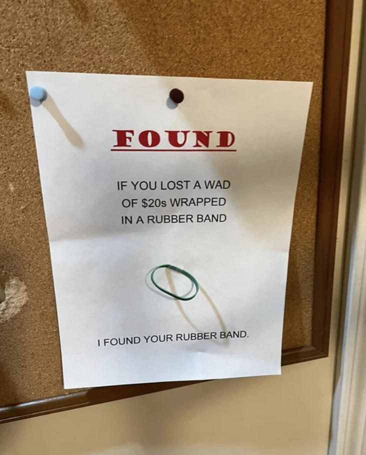 Sign saying &quot;If you lost a wad of $20s wrapped in a rubber band, I found your rubber band,&quot; with a rubber band affixed to it