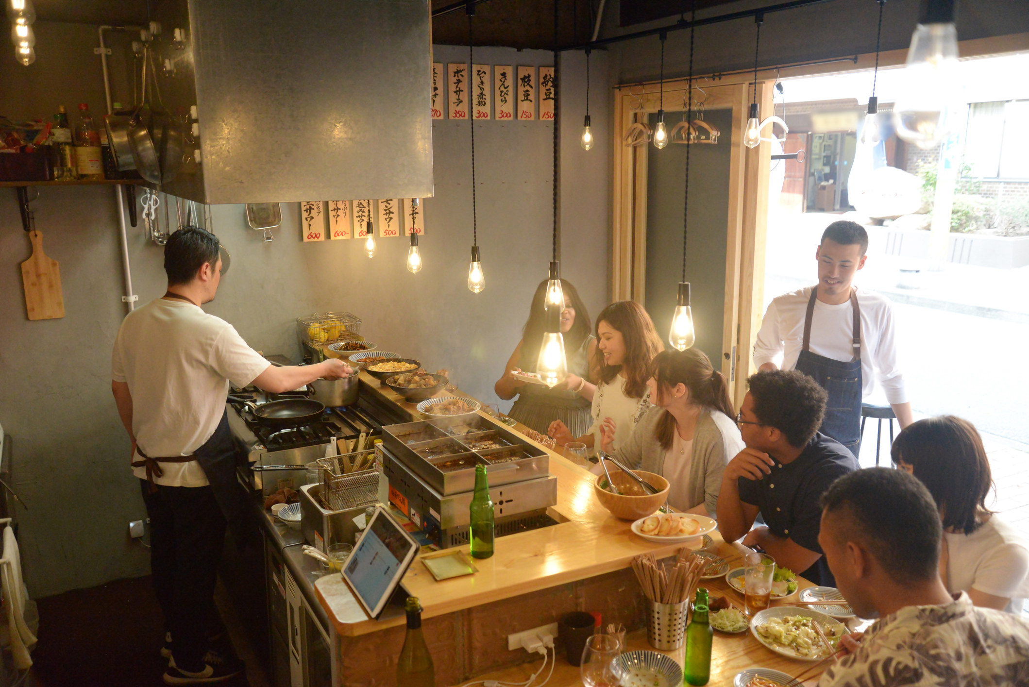 People sitting at restaurant chef&#x27;s counter