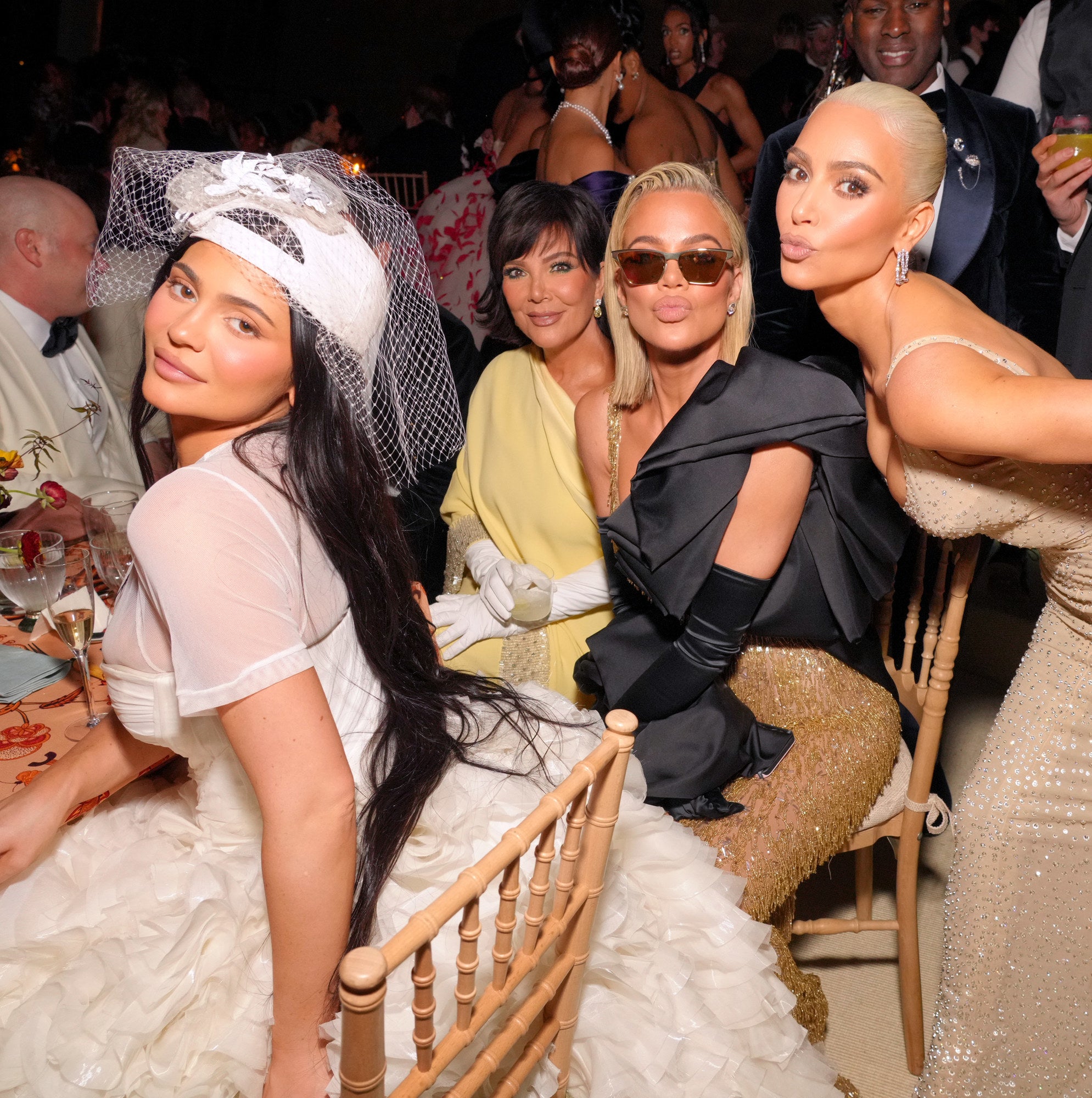 Kylie Jenner, Kris, Khloé, and Kim at a table