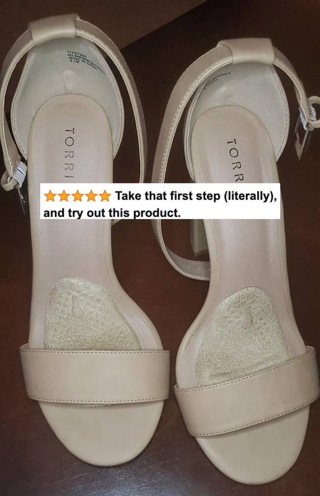 A reviewer's high heel sandals with the inserts and five-star review text 