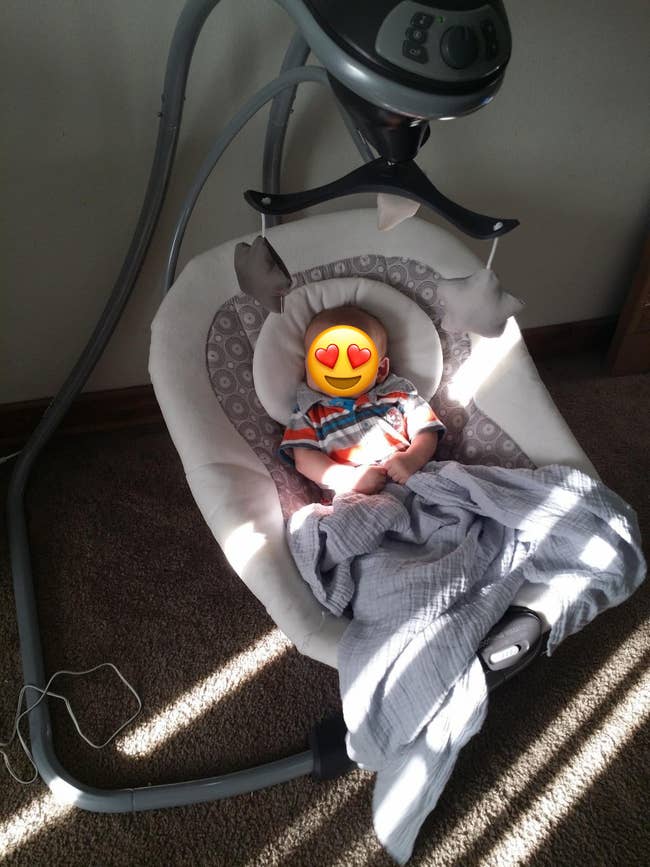 reviewer's baby in the swing