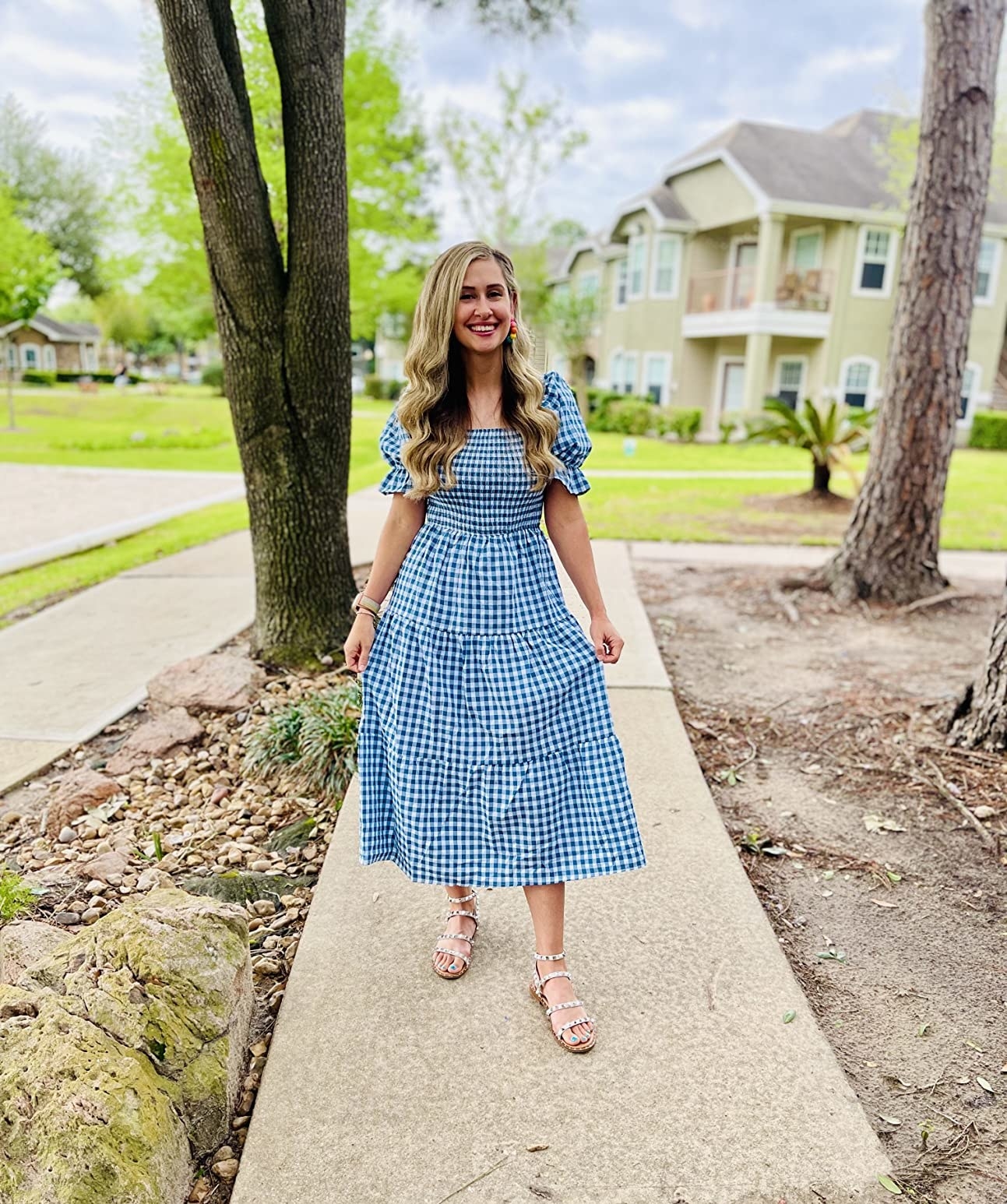 Reviewer wearing blue and white plaid maxi dress