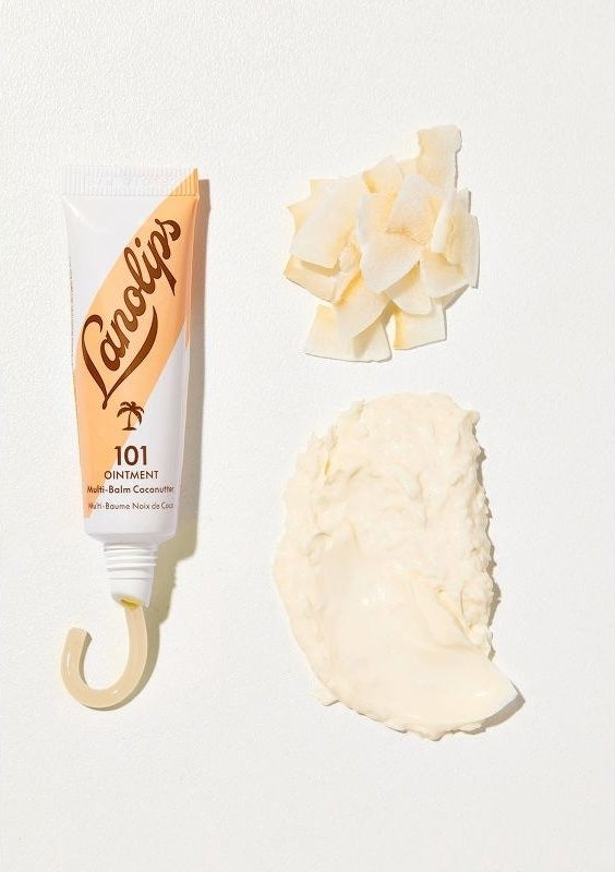 A beige tube of lanolips balm white ingredients next to it