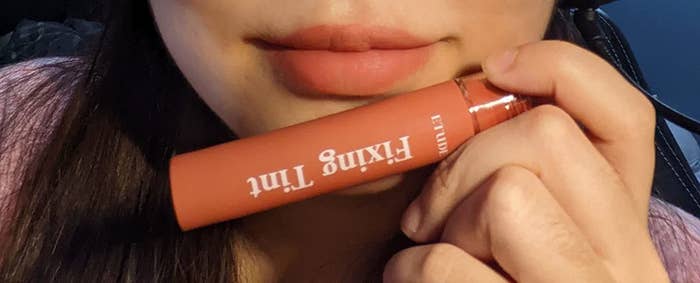 a reviewer wearing a lip fixing tint