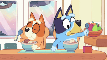 Bingo and Bluey from the show &quot;Bluey&quot; eating ice cream