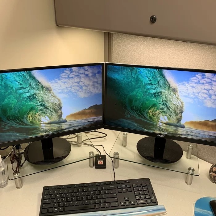 Reviewer&#x27;s photo of the monitor stands holding two monitors