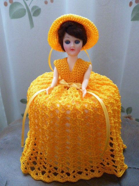 doll with crochet dress to cover the roll