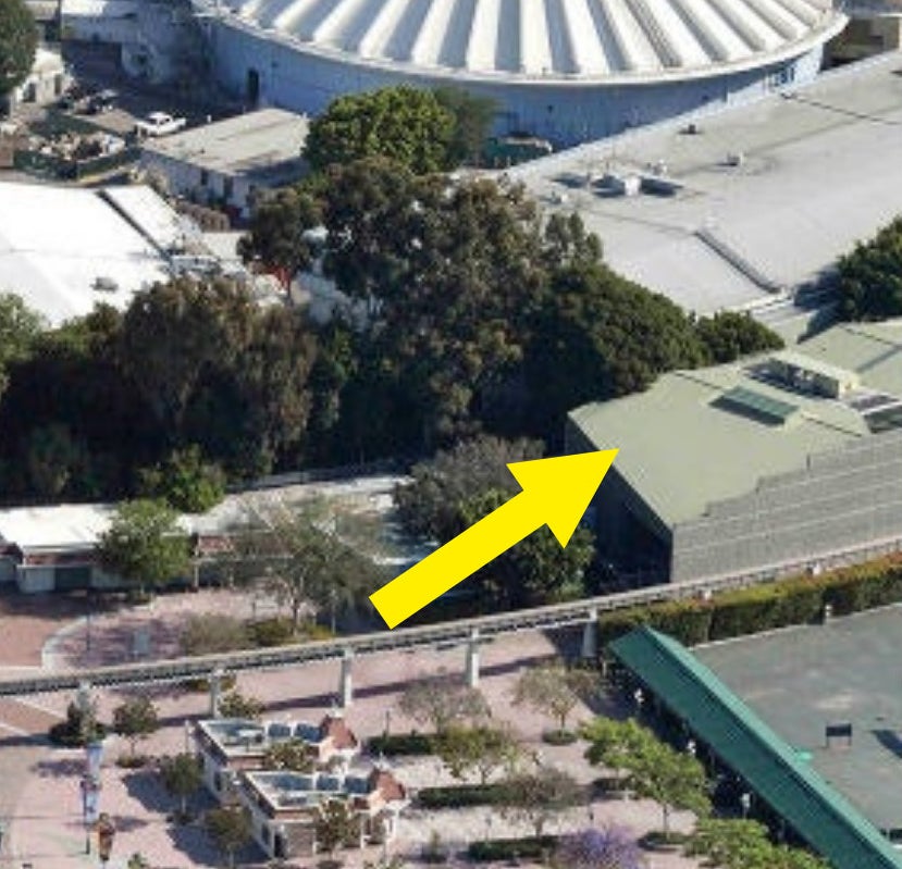arrow pointing to a building top painted in the color