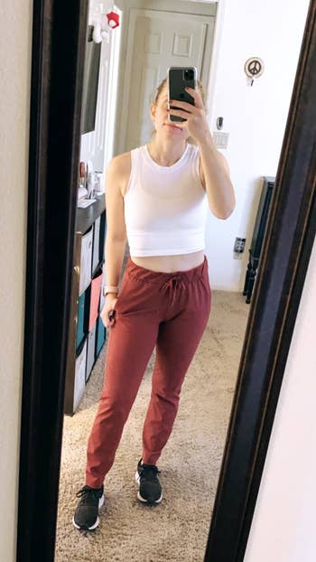 a reviewer wearing the pants in red