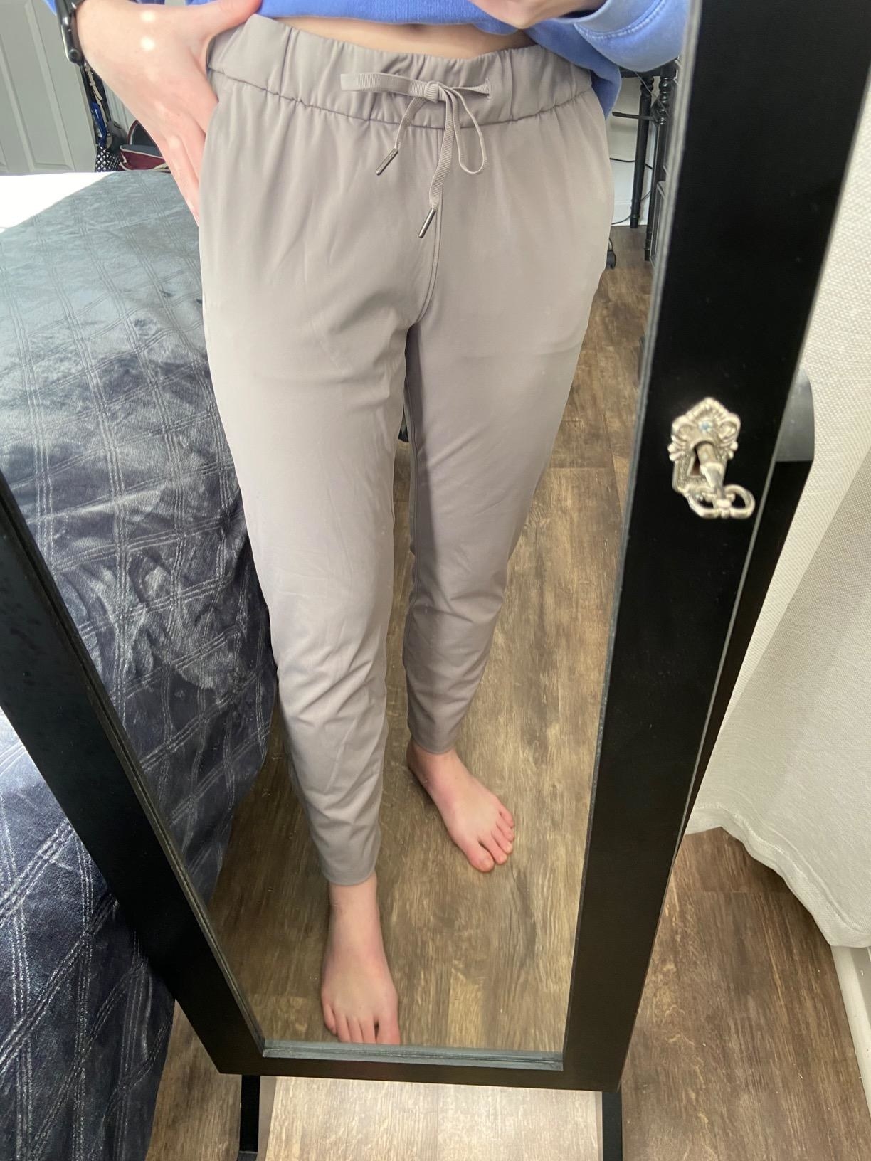 a reviewer wearing the pants in khaki