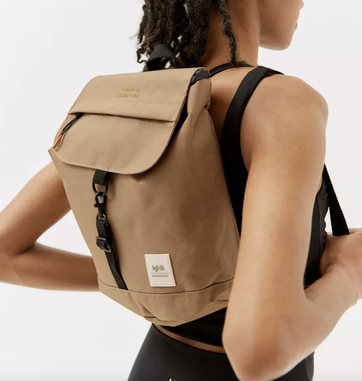 model wearing the mini scout backpack in camel brown