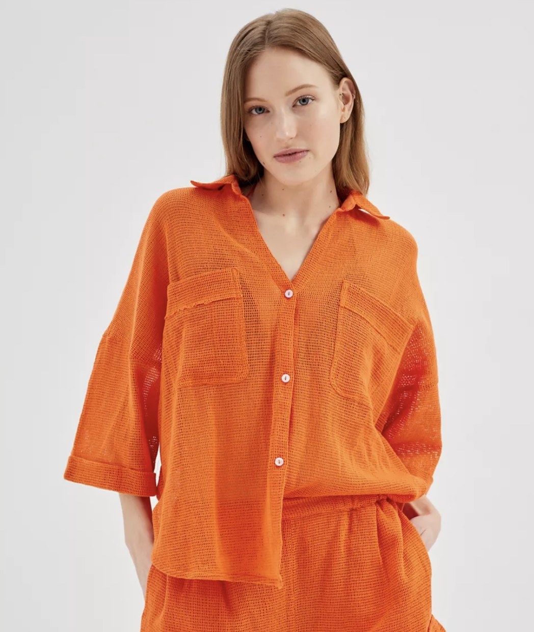 model wearing the boardwalk button down in orange