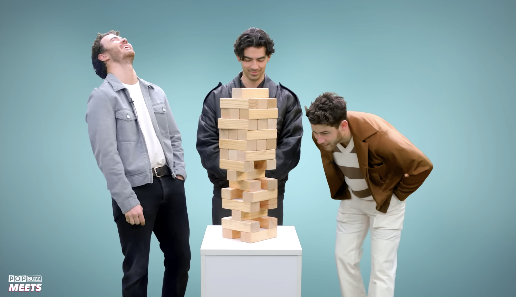 the brothers playing jenga