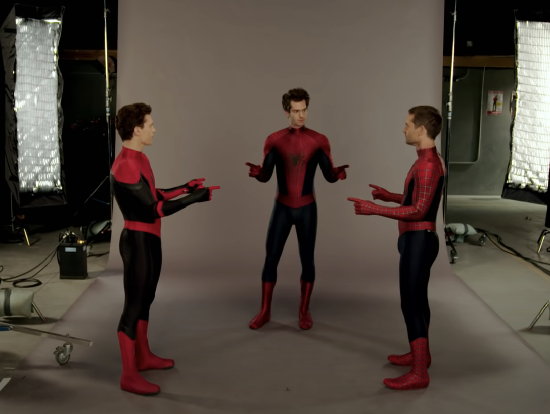 The three actors facing each other as Spider-Man