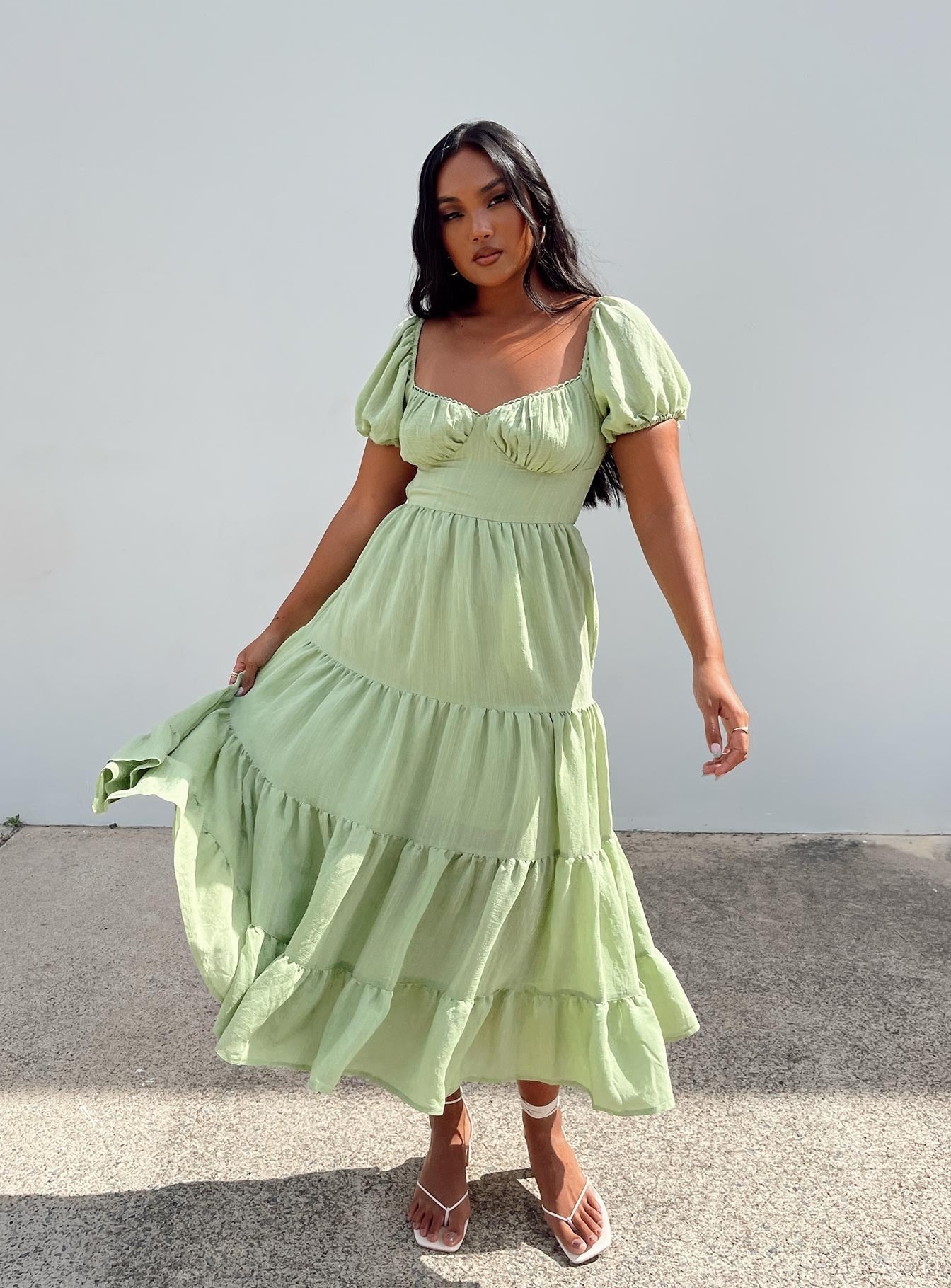 Model wearing the pale green midi dress