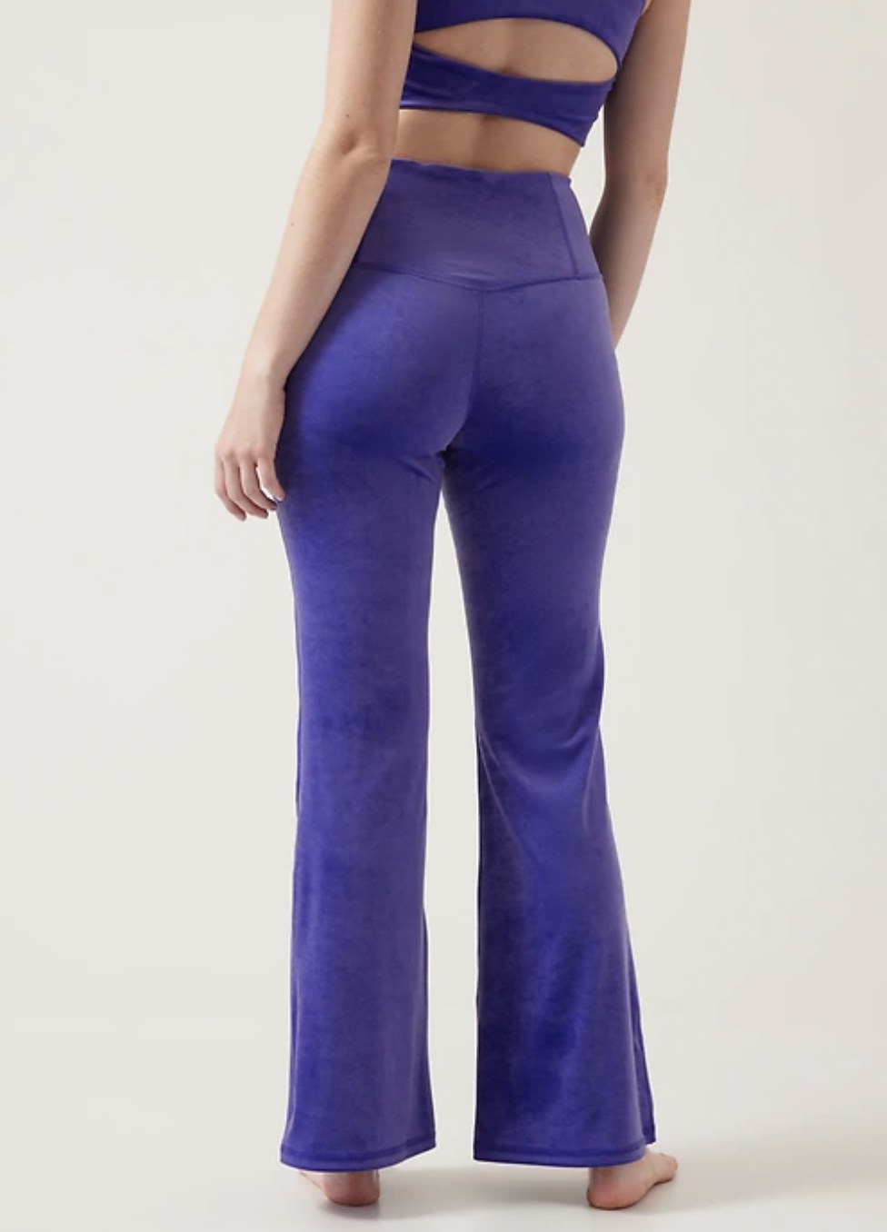 Model wearing the purple flare pants