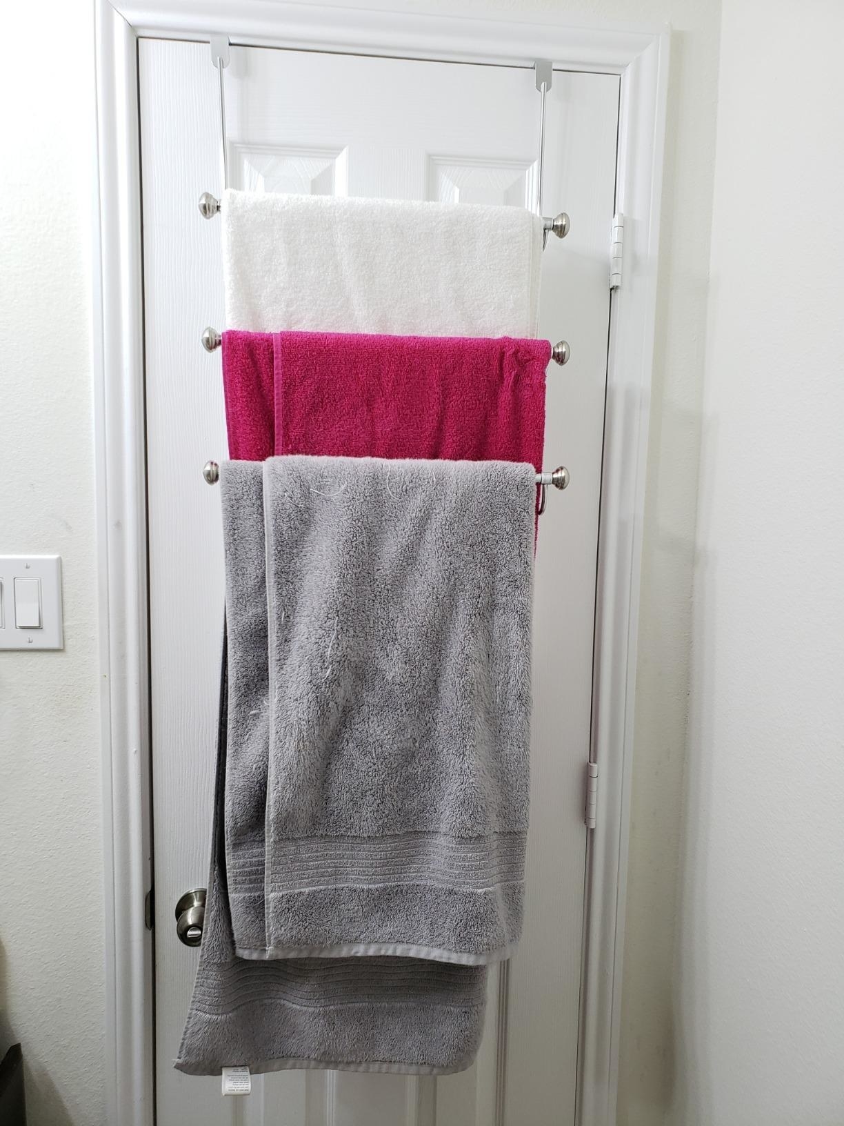 Reviewer image of towels hanging on over-the-door rack
