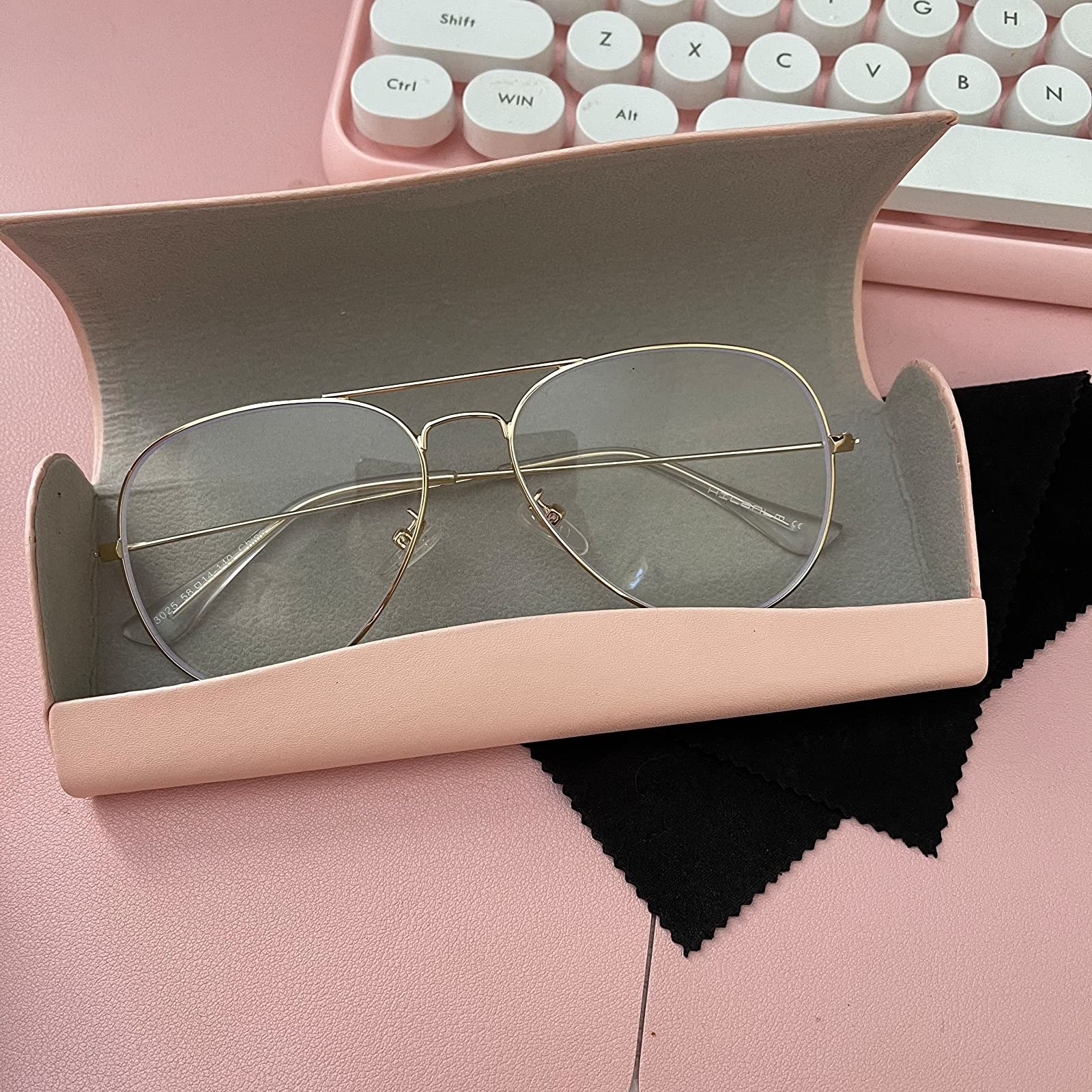 Reviewer image of their glasses in the pink case