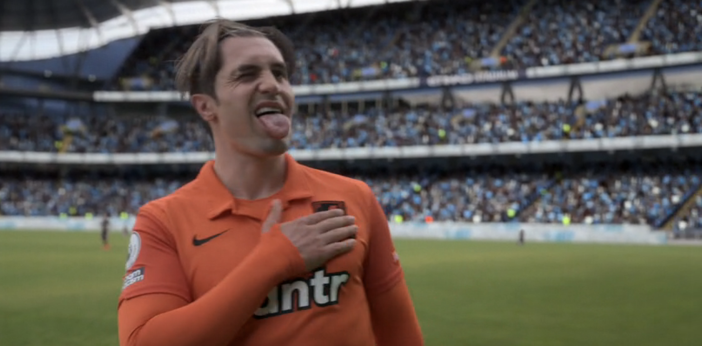 Jamie Tartt sticking his tongue out on the pitch