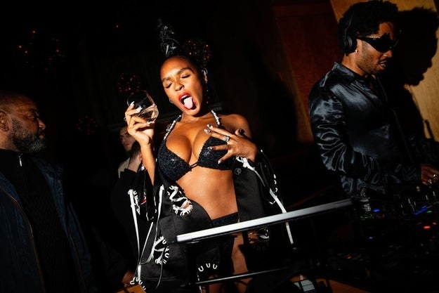 Janelle dancing in a sequined bikini at a Met Gala after party