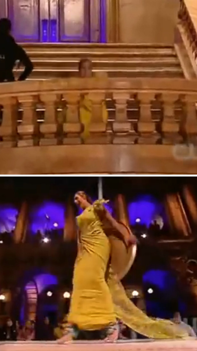 A contestant falls after getting hit by a pendulum