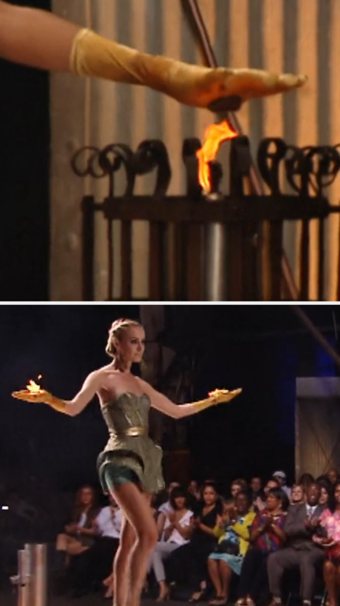 A contestant lights her hand on fire and proceeds to walk down the runway