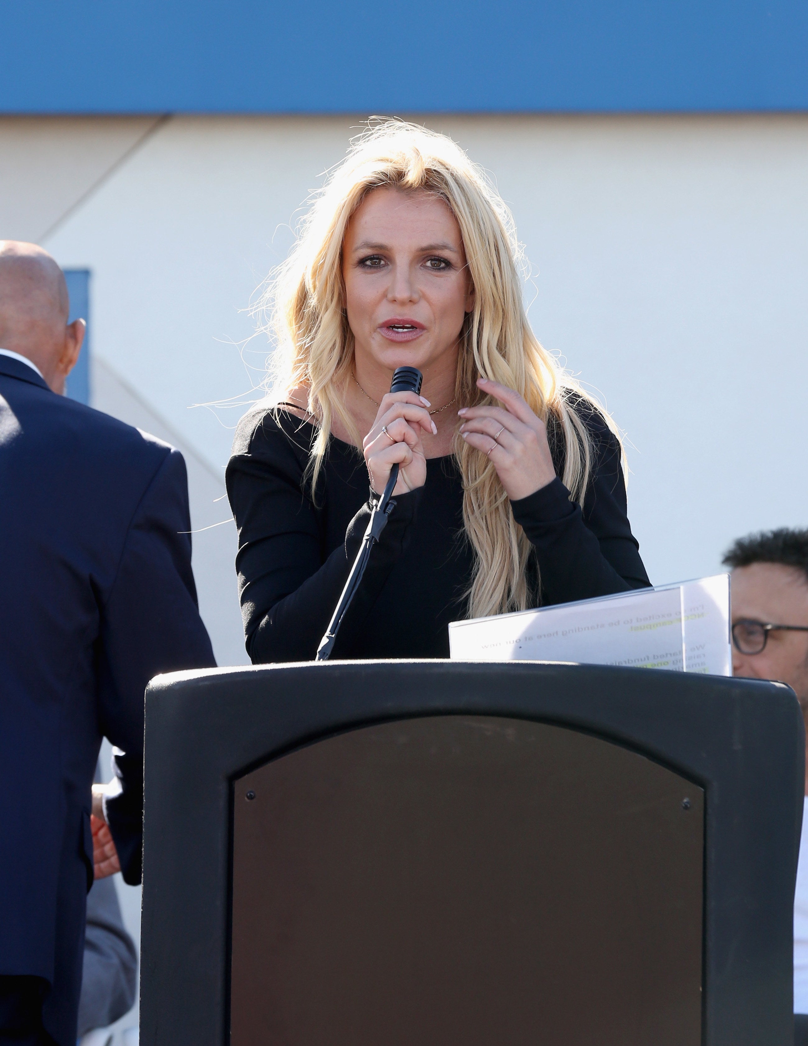 Close-up of Britney at a podium