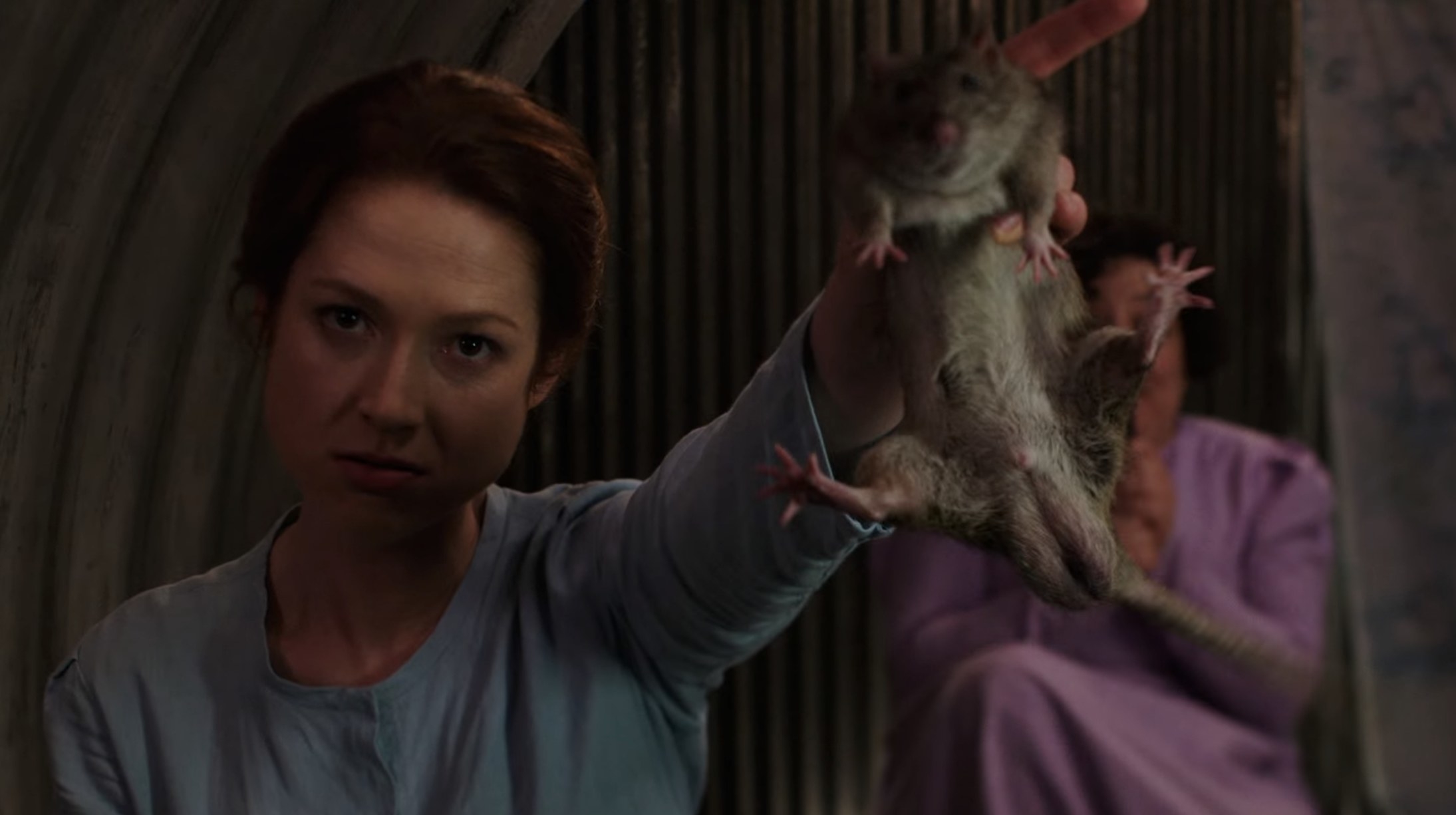 kimmy schmidt holding up a rat