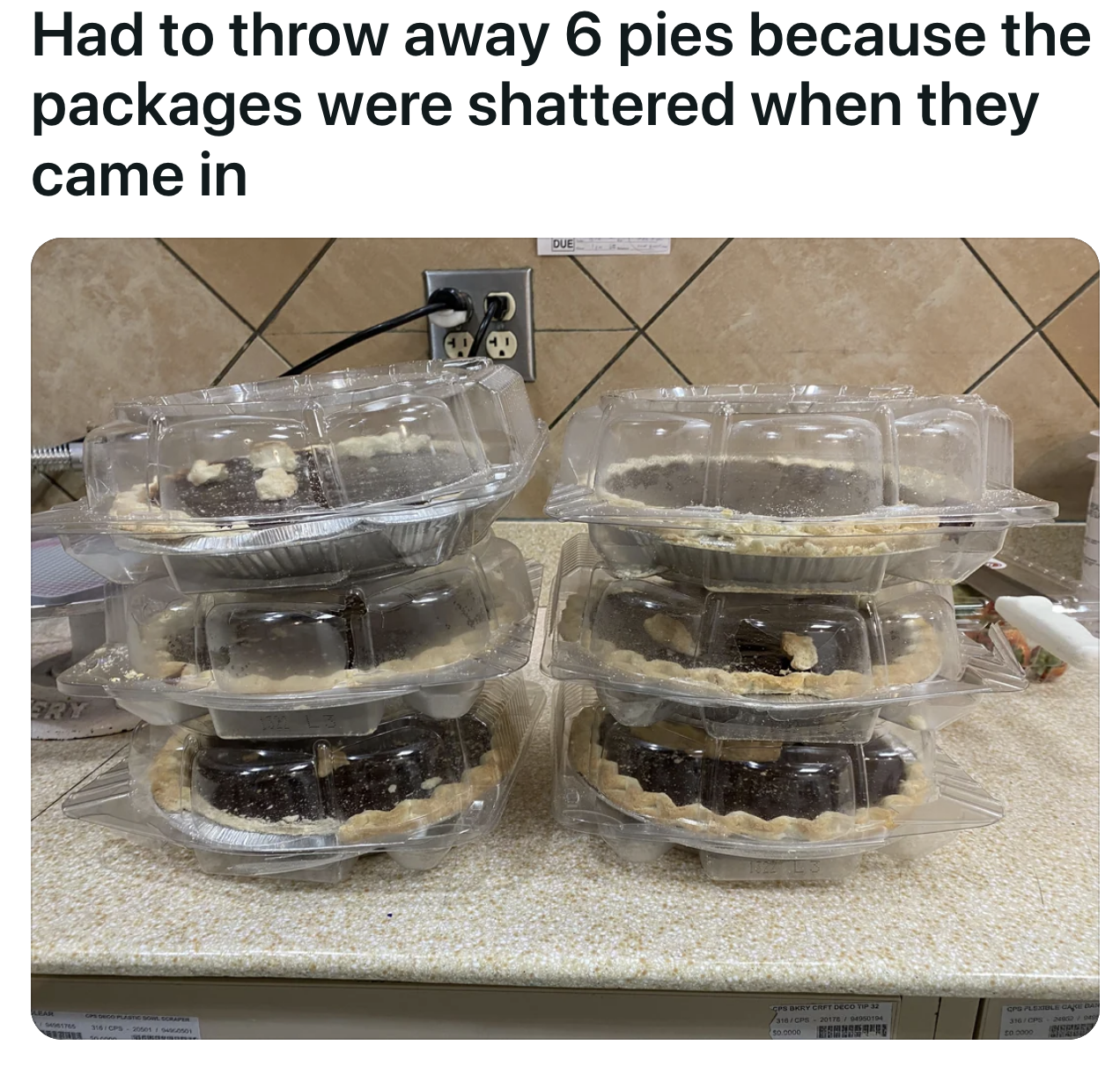 A group of six pies being thrown away because the packaging they&#x27;re in was dented; the pies themselves were unaffected