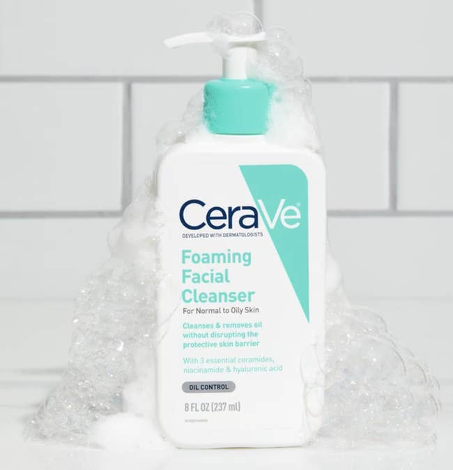the bottle of facial cleanser with bubbles on it