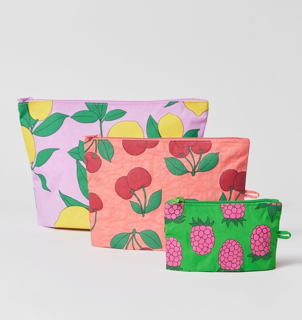 three pouches in three different sizes in fruit patterns
