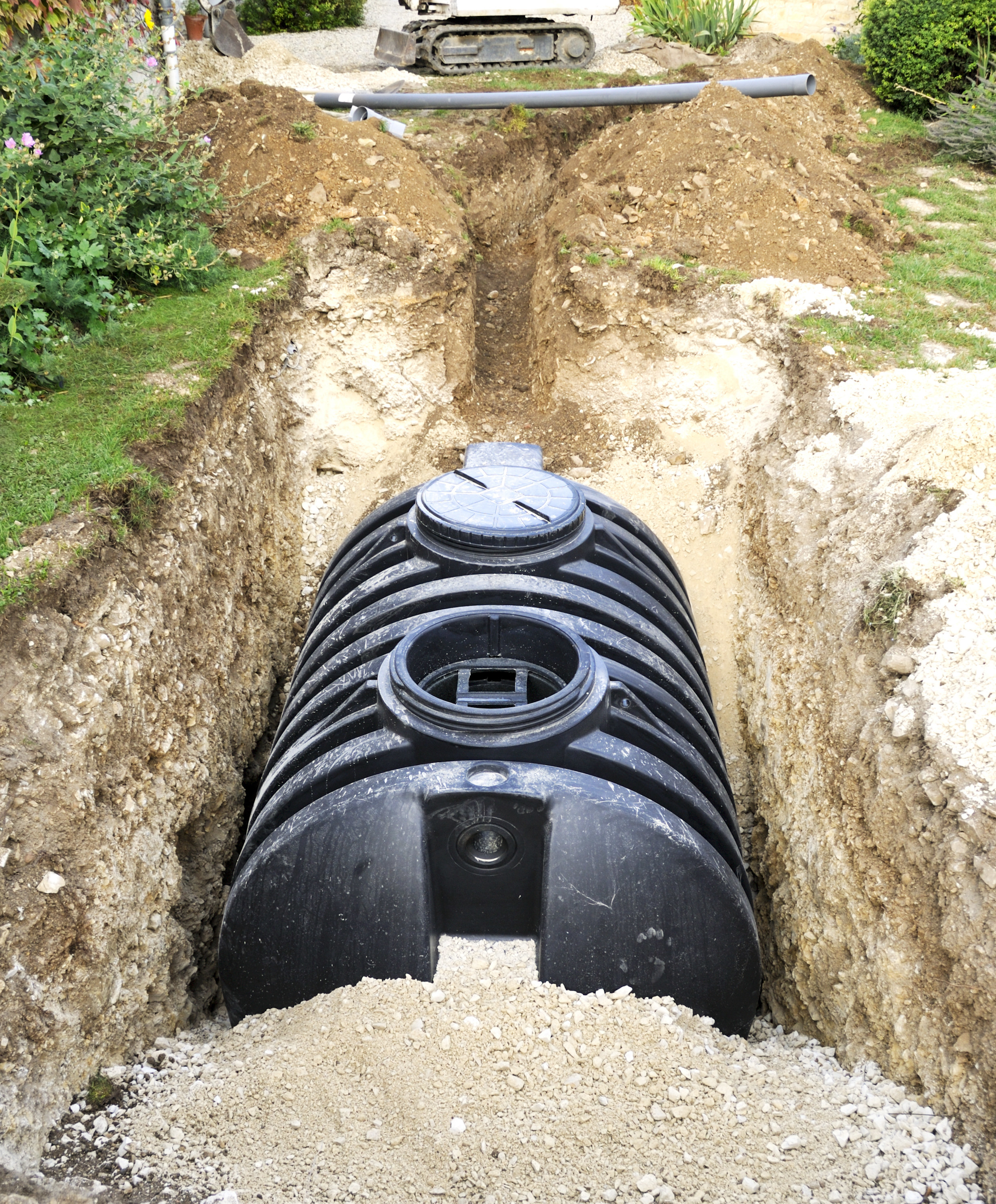 septic tank being buried in the backyard of someone&#x27;s house